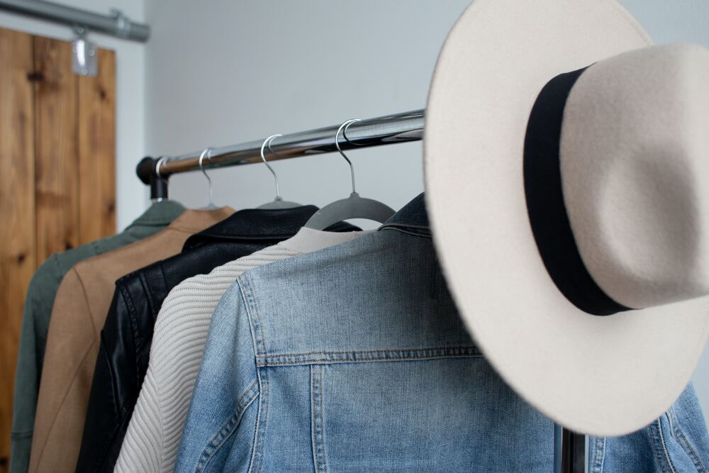 A clothing rack of someone who has a minimalist wardrobe