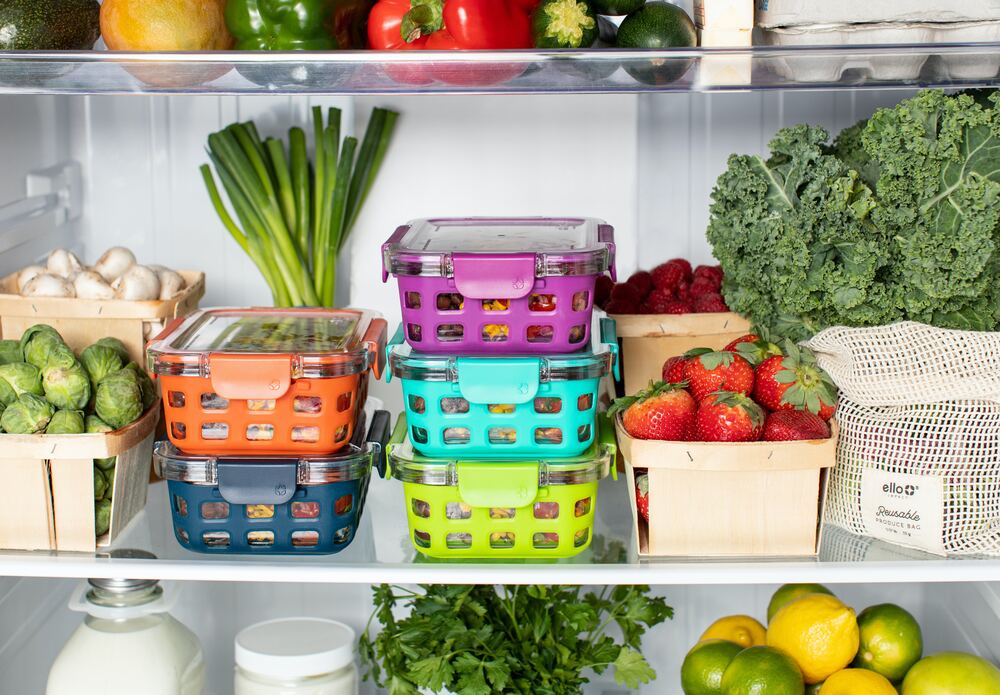 a fridge full of Tupperware and groceries that represent a tip for how to budget money 