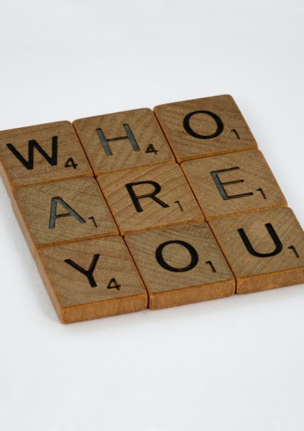 an image of blocks that say 'who are you' that represents becoming your most authentic self