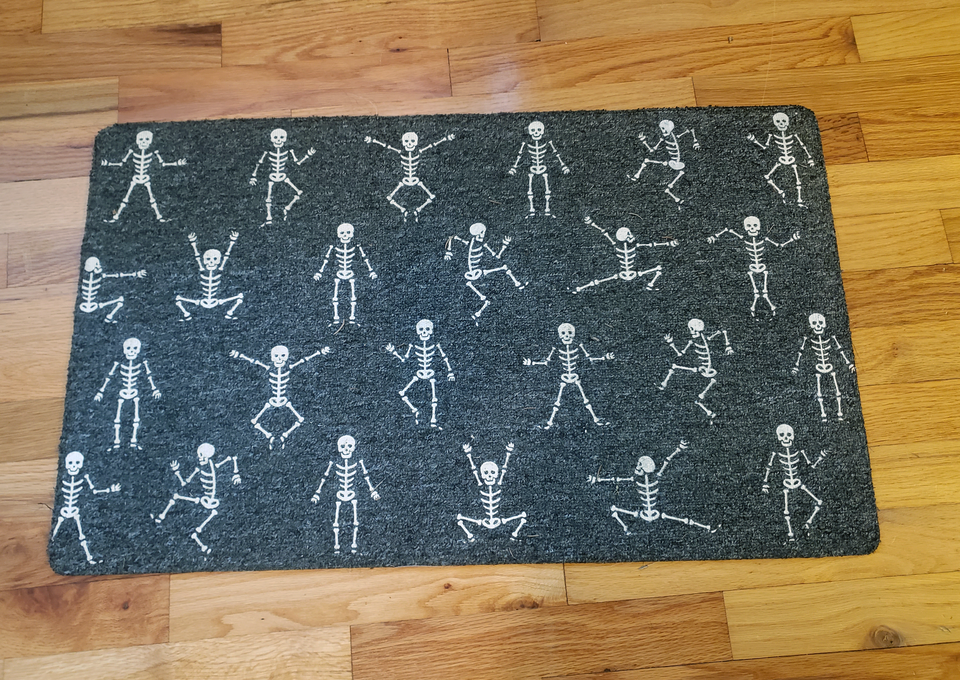 An image of a skeleton entry way mat that I got rid of during my declutter