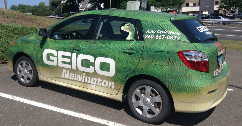 A car wrapped in GEICO car advertising, a great way to generate passive income