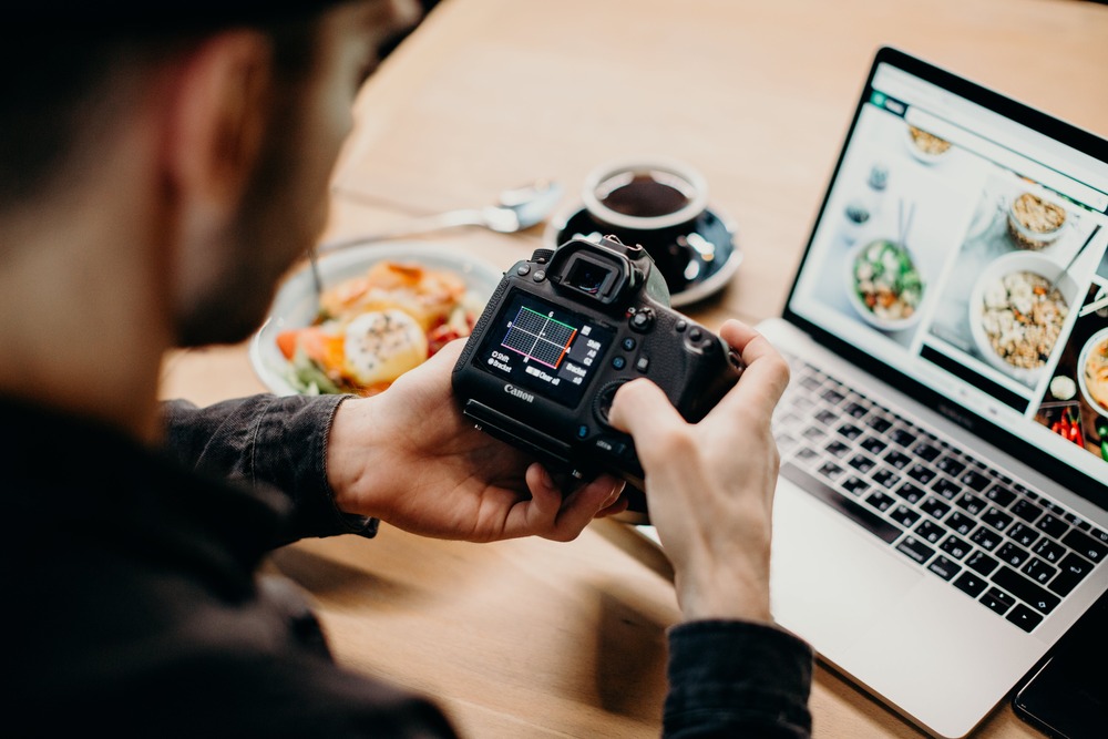 A man taking food stock photography to generate passive income