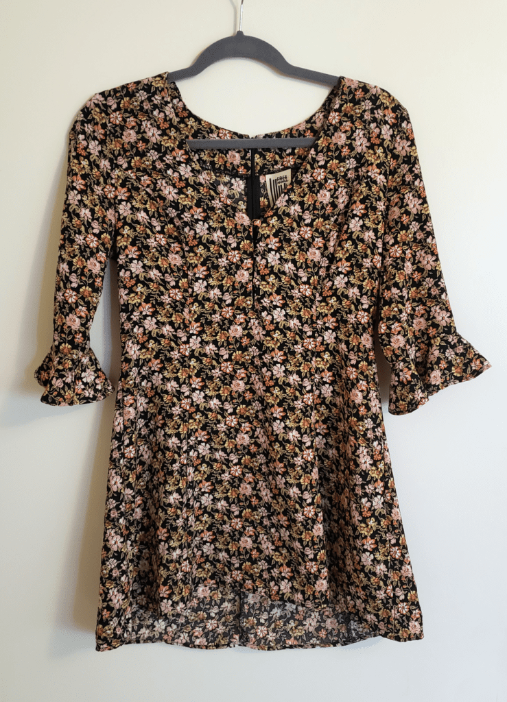A floral dress that I plan to donate or sell