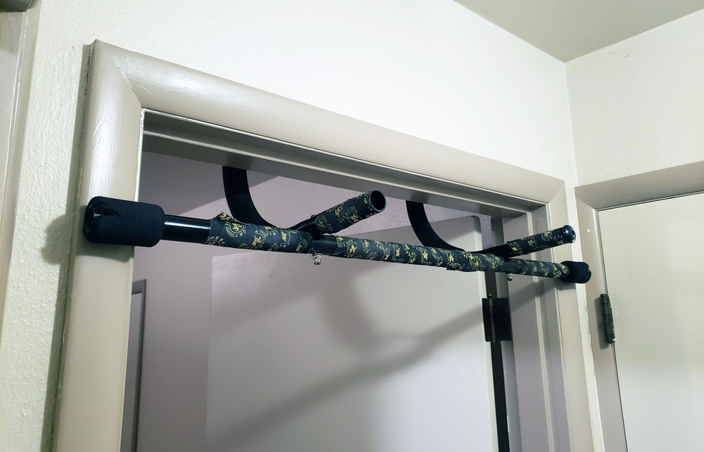 An image of a pull up bar on a door frame